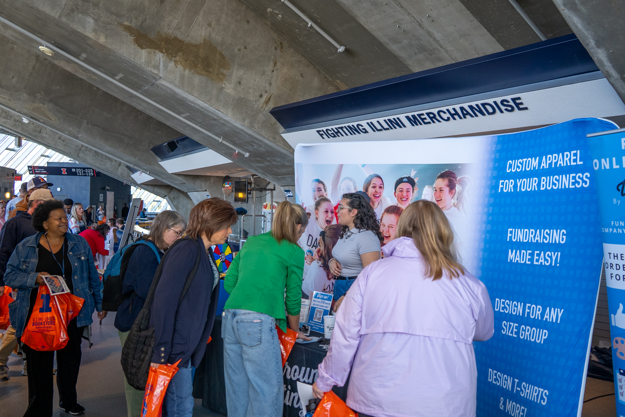 Employees visiting booths and connecting at the 2025 All Employee Expo