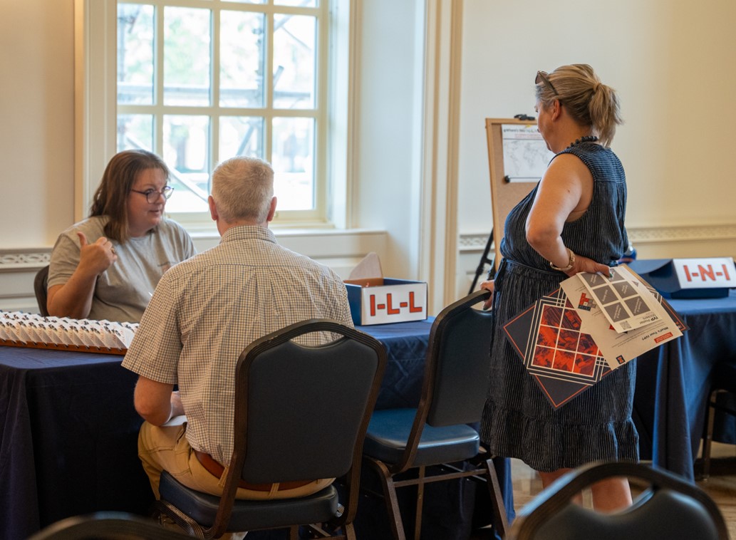 Employees participating in the Illinois Value Proposition pop-up event on campus